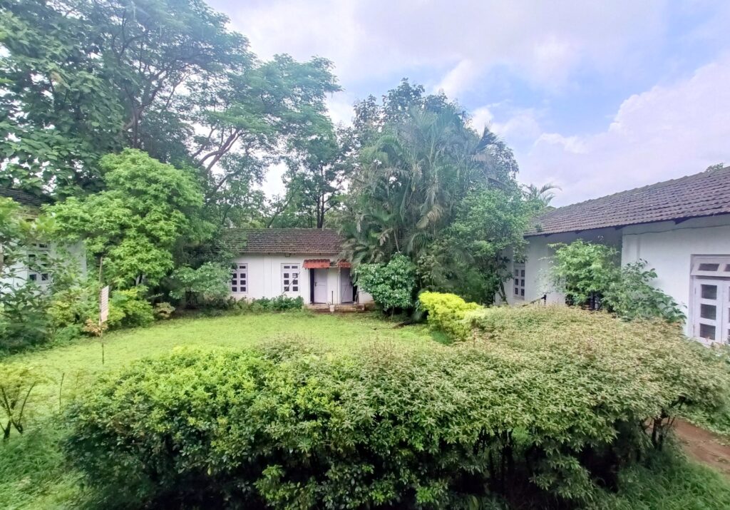 Cottages and garden lawn at Anand Vihar Retreat