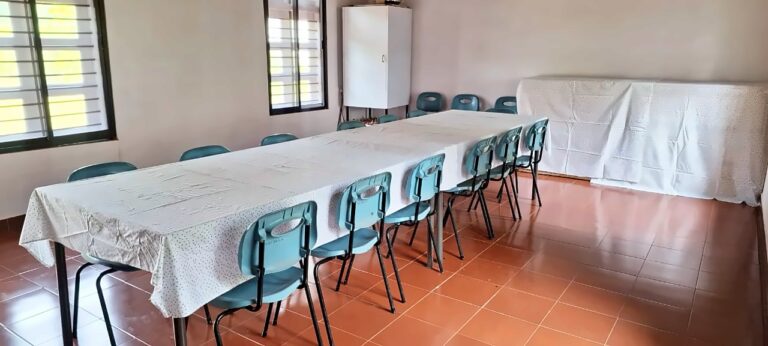 The dining hall with long shared tables
